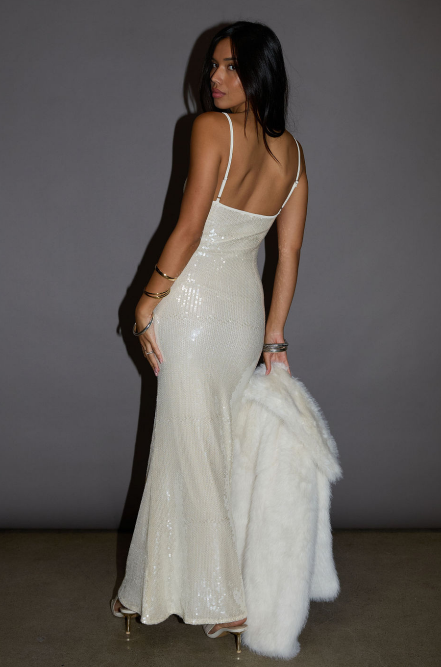 white Sequin knit maxi dress. cream Sequin knit maxi dress. Adjustable straps. Side hook and eye and zipper closures. Fully lined. holiday look. holiday outfit. christmas outfit. new years outfit
