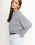 Fuzzy knit cardigan
Crewneck
Front button down closures
Long sleeves
Unlined
grey cardigan