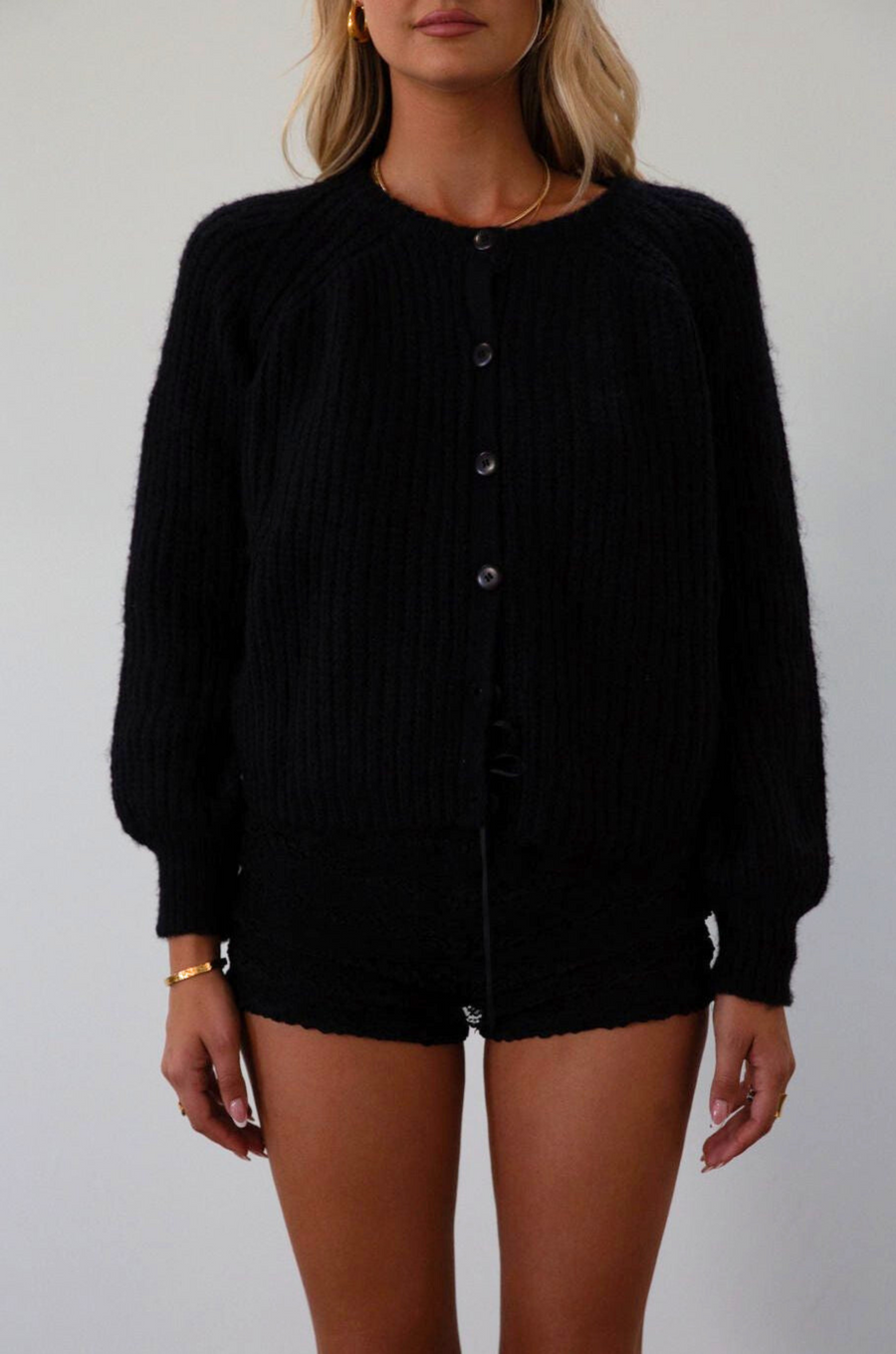 Fuzzy black crochet knit cardigan. Front button down closure. black sweater cardigan. fall outfit. fall transition 