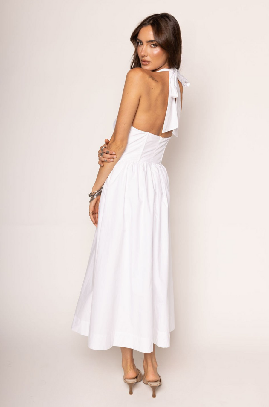Woven midi dress
Adjustable halter neckline
Boning in bodice
Side pockets
Elastic back neckline
Back hook and eye and zipper closures
Fully lined
white midi dress
bridal dress
bridal shower dress