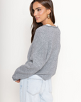 Fuzzy knit cardigan
Crewneck
Front button down closures
Long sleeves
Unlined
grey cardigan