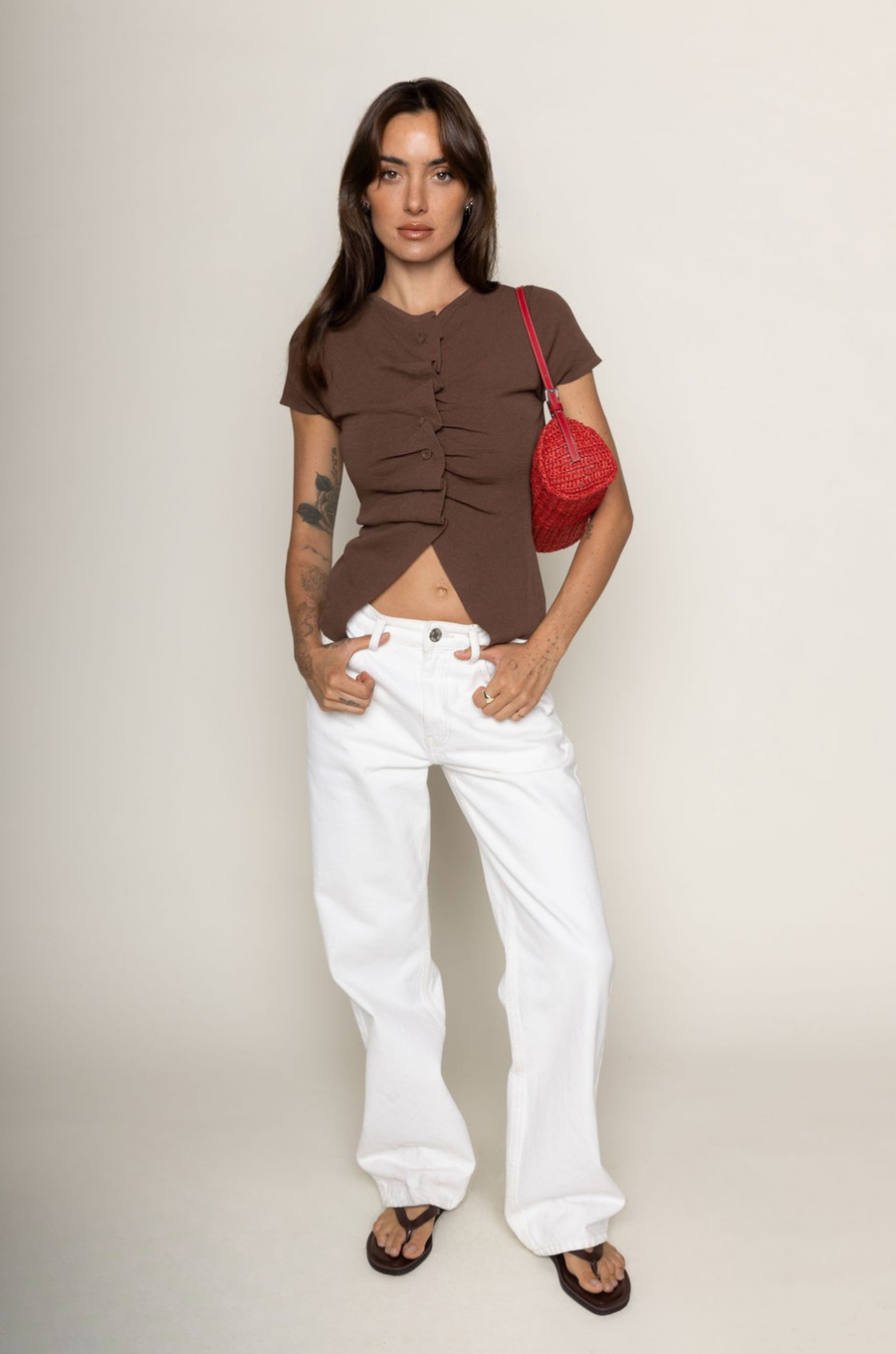 brown Knit button down short sleeve top
Button down closure
Open bottom hem line
Unlined