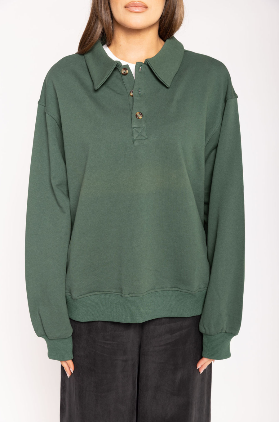 Knit sweater top
Collar neckline
Front button down closure
Unlined
hunter green sweater
