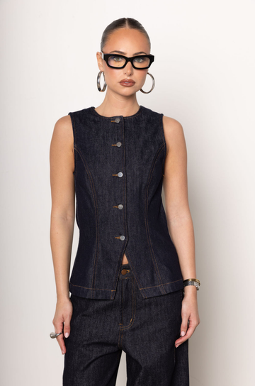 Denim vest top
Button down closure
Sleeveless
Unlined
V cut out at hemline
Length: 24"
Cotton
dark denim top
fall outfit
fall top
denim on denim outfit