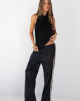 black Halter neck top
Low back
Neck button closure
Partially lined