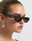 brown Sleek rectangular sunglasses
Featuring a structured silhouette with a bold frame and tonal lenses
Chunky acetate frame
