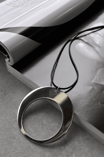 Silver pendant necklace with black rope