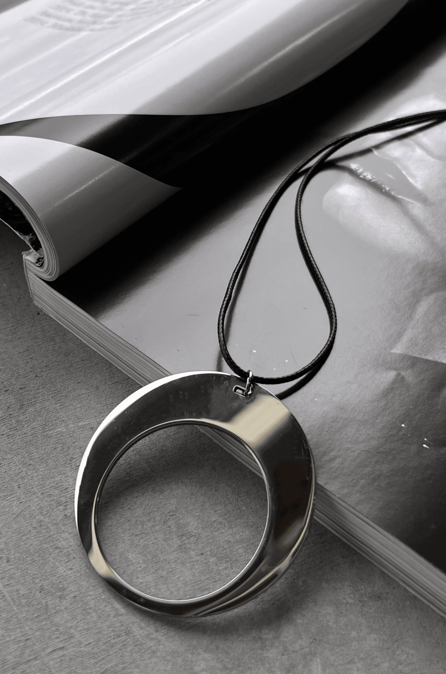 Silver pendant necklace with black rope