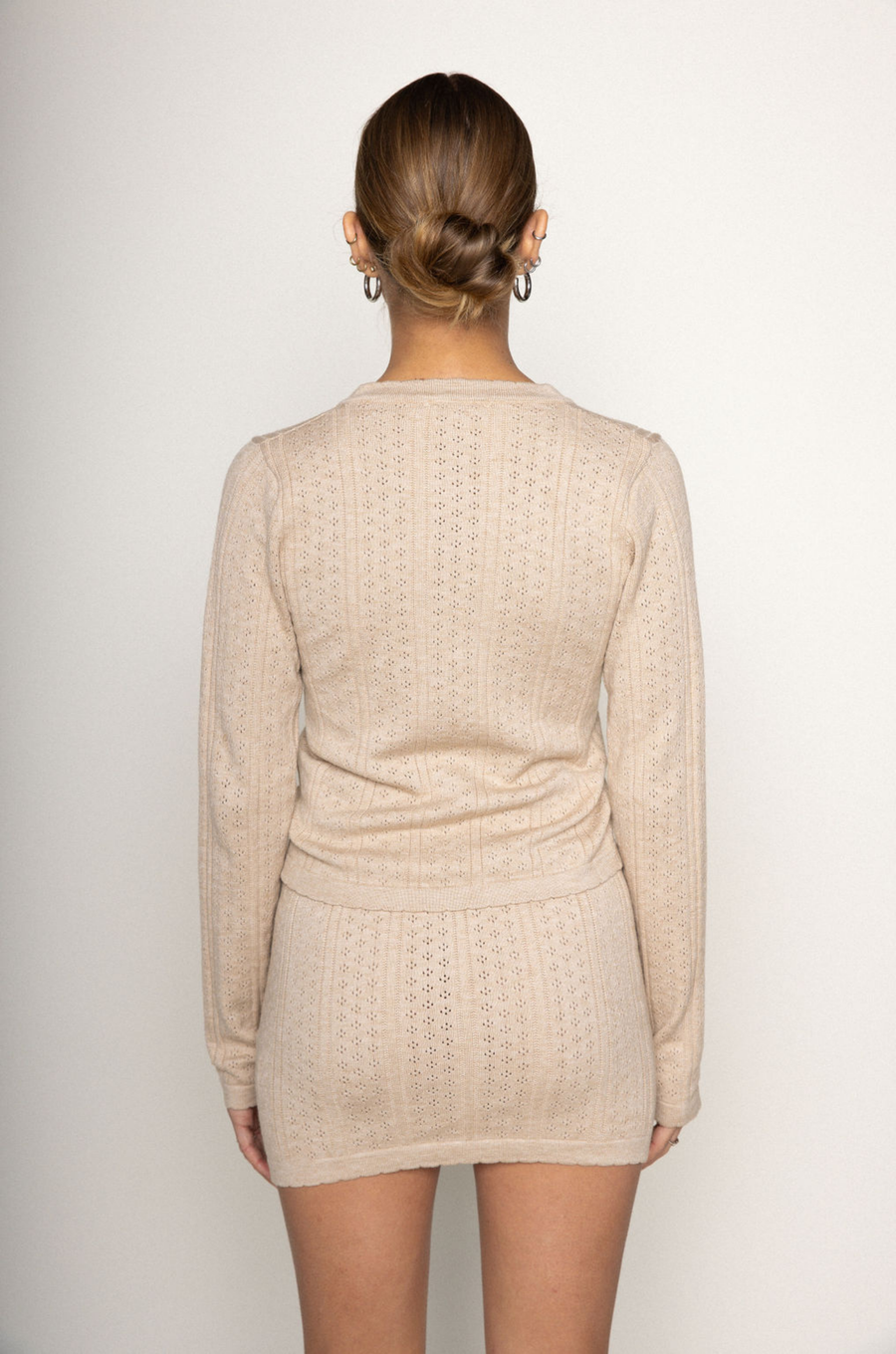 TOP
tan Knit eyelet cardigan
Scollop trim
Front button closure
Unlined

SKIRT
tan Knit eyelet mini skirt
Scallop trim
Elastic waistband
Unlined

summer knit set
spring knit set