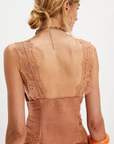 Ruched satin bodice tank top
Smocked backing
Lace trim throughout
V-neckline
Triangle cups
Full length
Asymmetrical hem
peach satin lace tank top