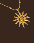 Gold necklace with a sun-shaped pendant necklace
18K Gold Non-Tarnish Boho Sun Necklace
18K Gold Plated
Stainless Steel
Pendant Size: 1.5" / Chain Length: 15.57" / Extension Length: 2"
Lead-free
Nickel-safe
Hypoallergenic
Water Resistant
