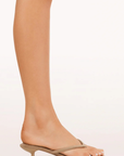 Open round toe
Two thin thong straps across upper
Padded sole for extra comfort
Slip on design
Open heel counter
Synthetic
Heel height 1.96"
tan suede kitten heel