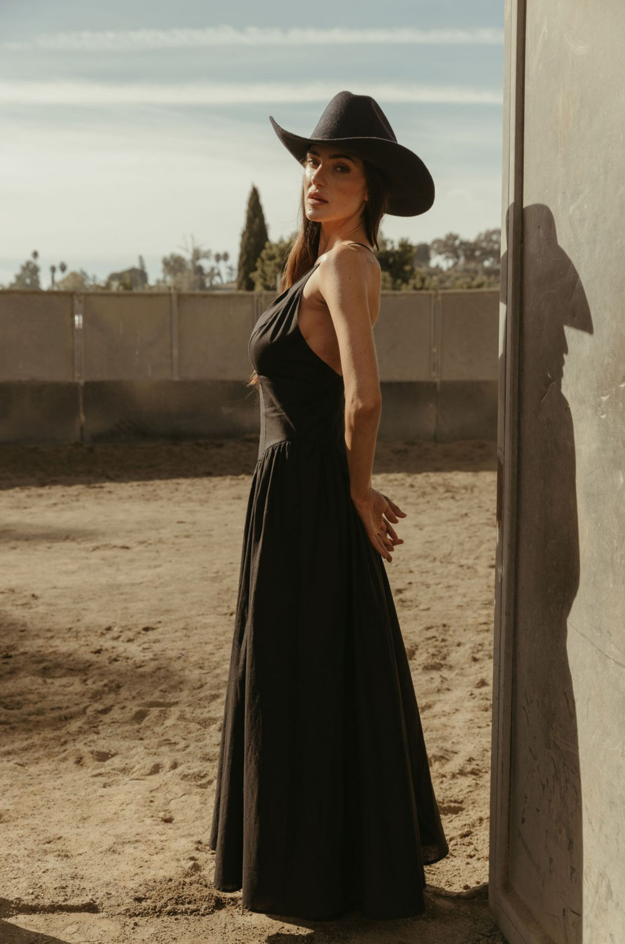 Woven maxi dress. Adjustable crisscross back straps. Back hook and eye and zipper closures. Fully lined. black maxi dress. country outfit. country dress. western outfit. western dress.