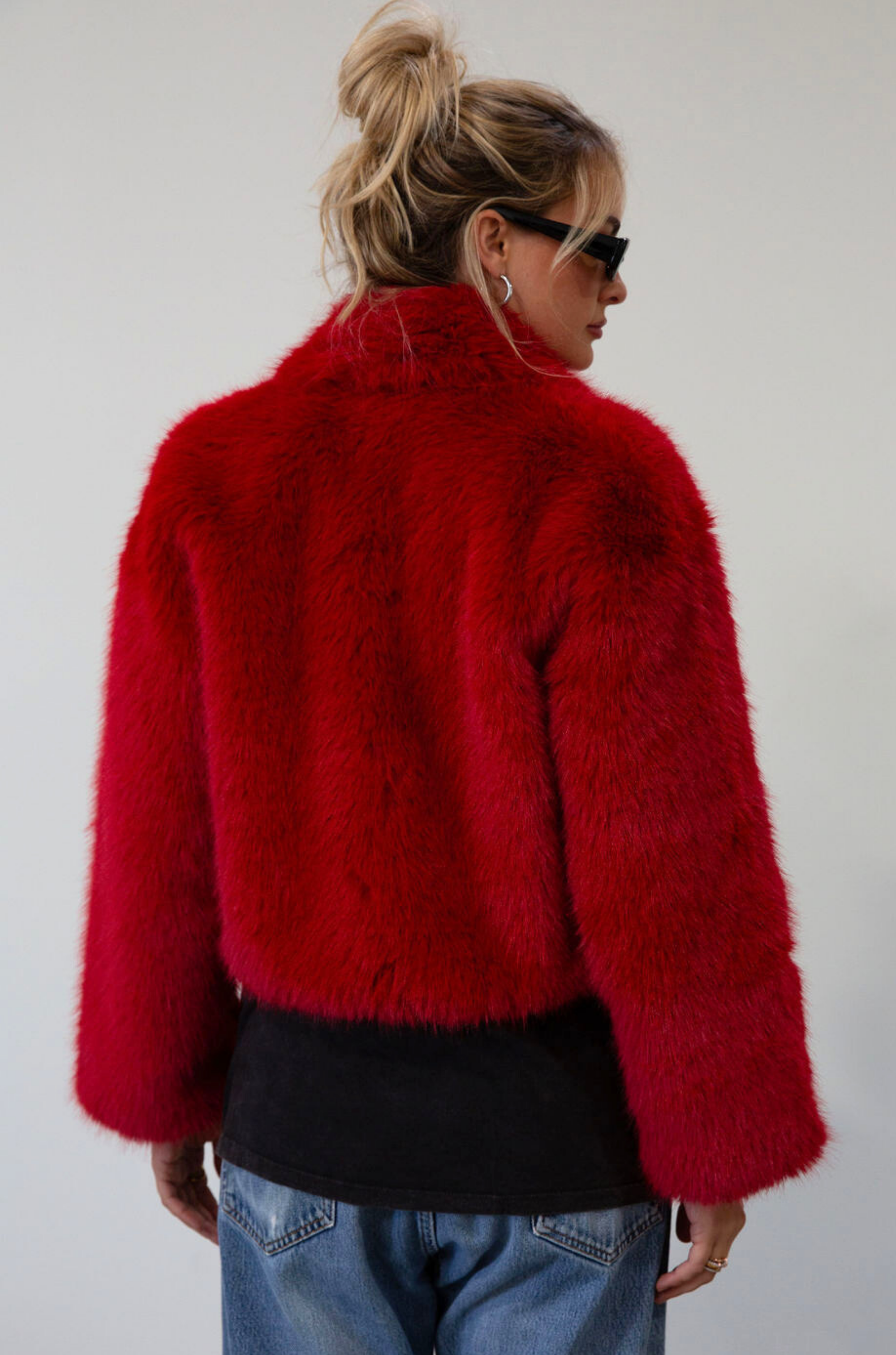 Faux fur coat. Collar neckline. Front zipper closure. Side pockets. Fully lined. red fur coat. fall coat. winter coat. red faux fur coat