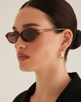 brown Oval sunglasses
Gold hardware engraved with Banbé logo on outer left arm
Scratch resistant/category 3/polarised lens
100% UV protection
Acetate frame
Width: 10.4cm / Lens Height: 3cm / Arm Length: 14cm / Nose Bridge: 1.9cm