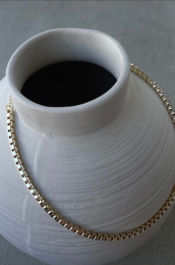 Square chainlink gold necklace. Adjustable lobster clasp closure.