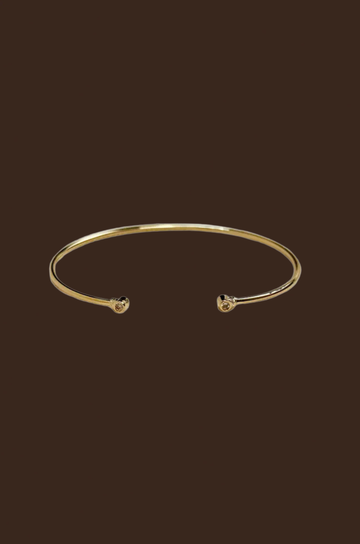 Gold cuff bracelet 
18k Gold Filled Open CZ Cuff Bracelet
60mm diameter - adjustable sizing
Hypoallergenic jewelry
Nickel Free
Water-resistant