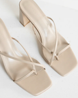 cream stone Cross over strap heels
Squared toe
Block heel
