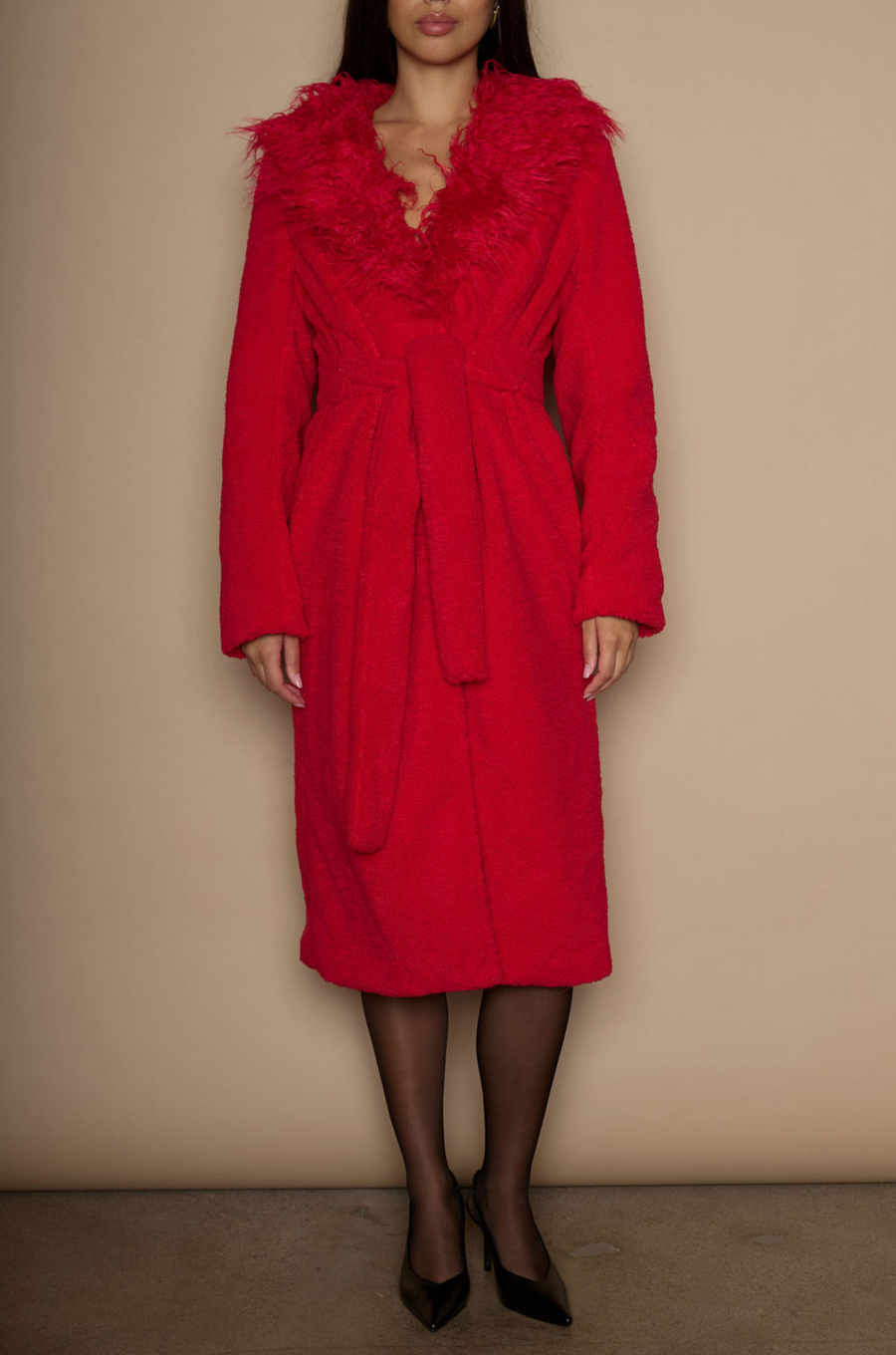 Faux sherpa longline coat. Faux fur collar neckline. Front snap button closure. Tie waist. Side pockets. Back slit. Fully lined. red fur coat. fall outfit. cute winter coat. trendy winter coat.