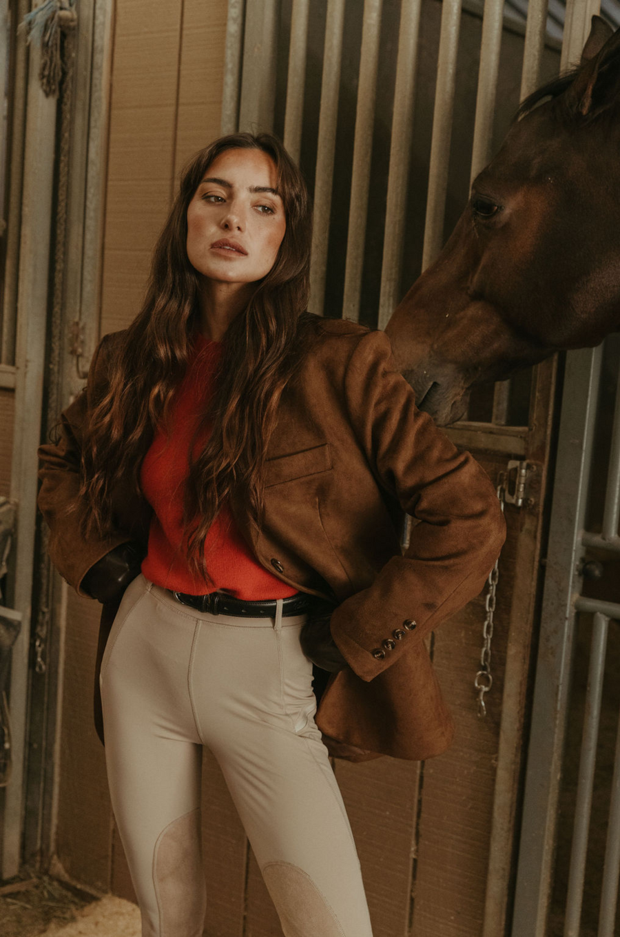 Faux suede single breasted blazer. Collar neckline. Front button closures. Front pockets. Long sleeves with faux button closures. Back slit. Fully lined. brown suede blazer. 