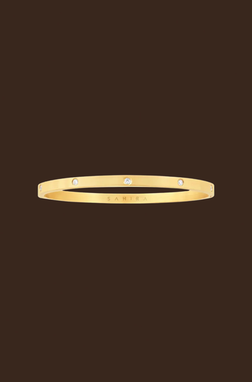 18k Gold plated bangle bracelet
CZ stone details
Stainless steel
Hypoallergenic
Tarnish Resistant