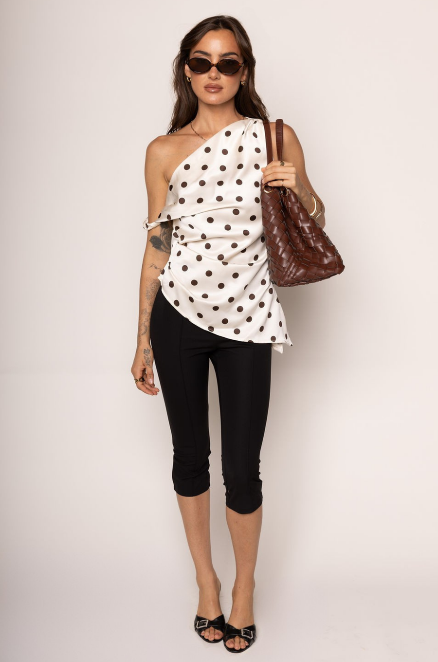 Satin polka dot tunic top
One shoulder
Asymmetrical hemline
Twisted shoulder strap
Side zipper closure
Unlined
white and brown polka dot one shoulder top
going out top
polka dot top