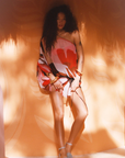 A one-shoulder blouson silhouette mini dress
Crafted from an ethereal viscose chiffon crinkle
Featuring our signature Picasso-inspired print.
Adjustable arm and waist tie