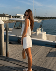 TOP
Woven cotton cropped tank top
Lace trim
Adjustable front tie

BOTTOM
Woven cotton mini shorts
Lace trim
Elastic adjustable waistband

white tank top and short set
cute lounge easywear