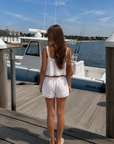 TOP
Woven cotton cropped tank top
Lace trim
Adjustable front tie

BOTTOM
Woven cotton mini shorts
Lace trim
Elastic adjustable waistband

white tank top and short set
cute lounge easywear