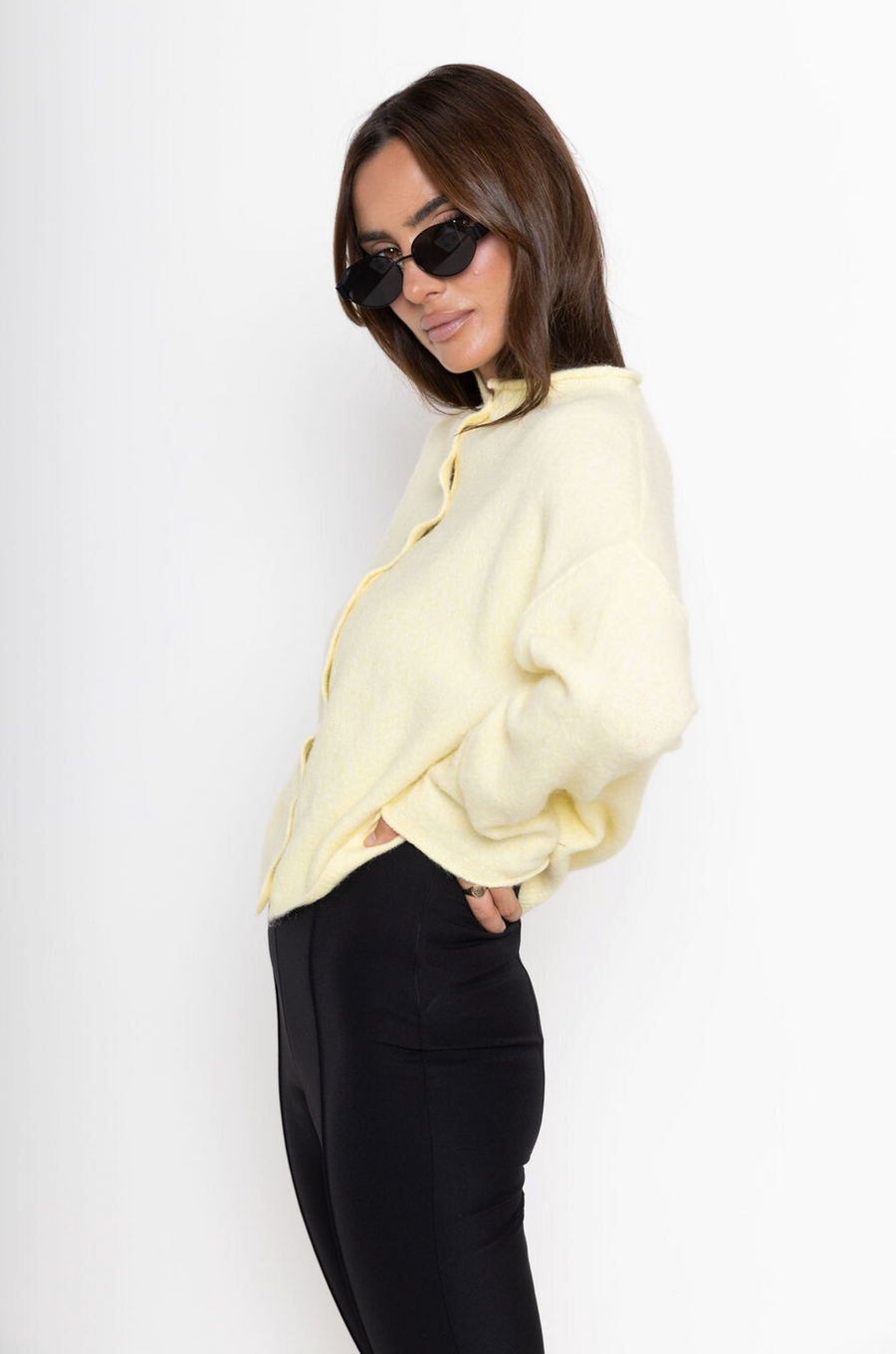 Fuzzy knit cardigan
Crewneck
Front button down closures
Long sleeves
Unlined
yellow cardigan