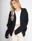 Fuzzy knit cardigan
Crewneck
Front button down closures
Long sleeves
Unlined
black basic cardigan
fall cardigan
fall sweater
fall outfit