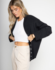 Fuzzy knit cardigan
Crewneck
Front button down closures
Long sleeves
Unlined
black basic cardigan
fall cardigan
fall sweater
fall outfit
