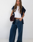 blue Wide leg denim pant
Hidden waistband with adjustable drawstring
5 pocket construction
Button closure
Unlined
Cotton/Polyester