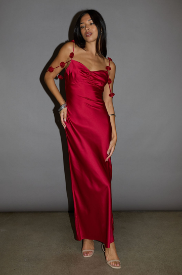 Satin maxi dress. Adjustable straps with rosette details. Side hook and eye and zipper closures. Unlined. red maxi dress. holiday look. holiday inspo. holiday outfit