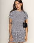 black and white Gingham printed smocked mini dress
Short sleeve
Has stretch
Unlined
Polyester
smocked bodice
summer mini dress
european summer outfit inspo