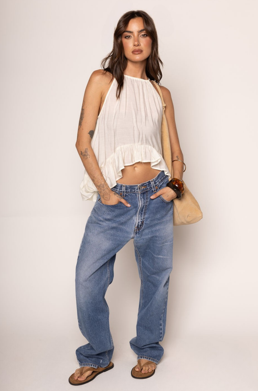 Woven halter top
Frilled trim
Adjustable neck tie
High to low trim
Unlined
cream boho top