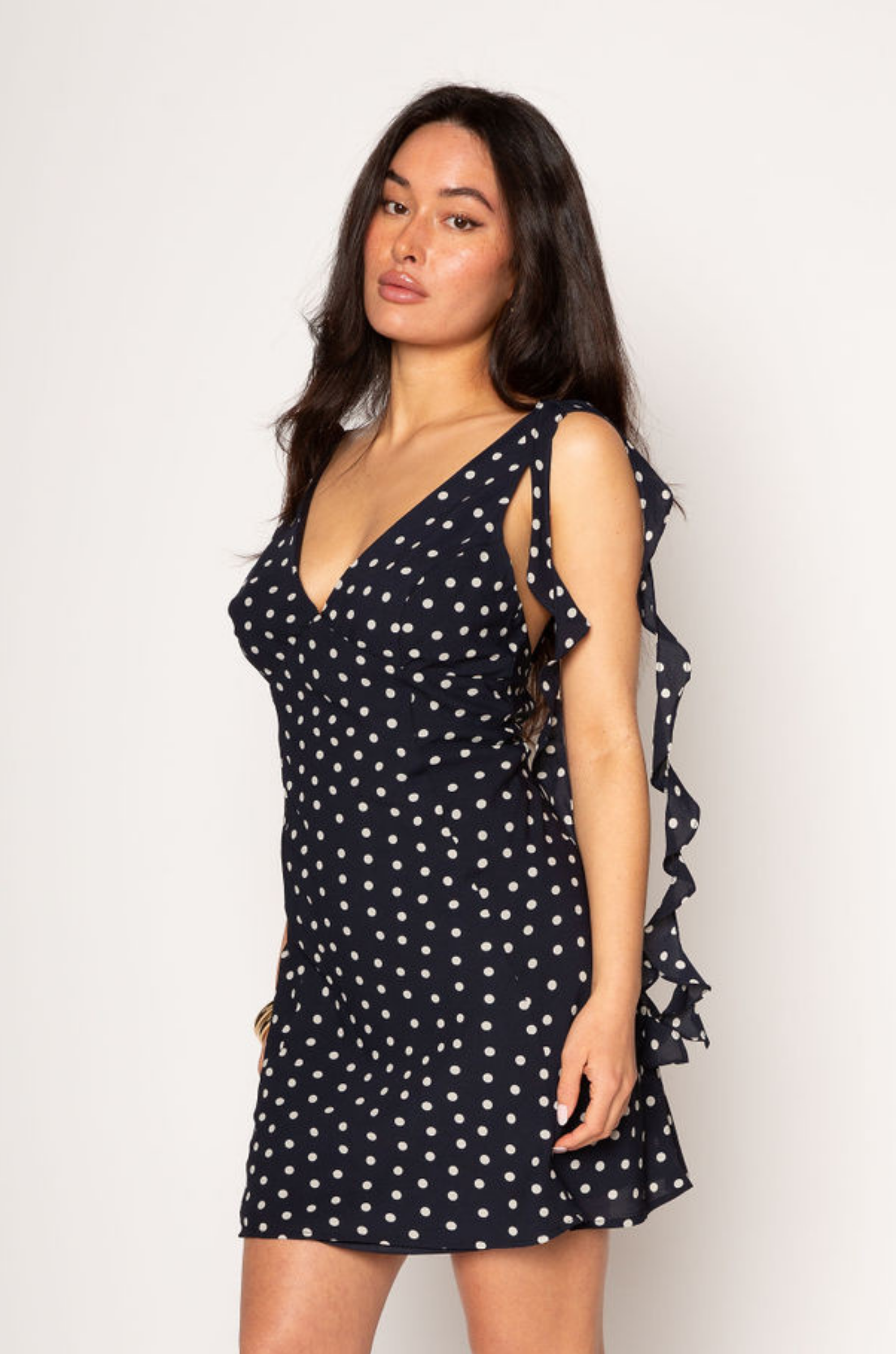 Polka dot chiffon mini dress. Adjustable straps. Back hook and eye and zipper closures. Fully lined. Ruffle trim. polka dot mini dress. summer dress. spring dress. 