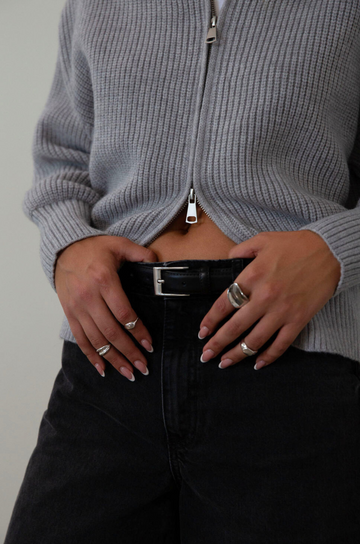 black Adjustable leather belt. Rectangular metal belt buckle.