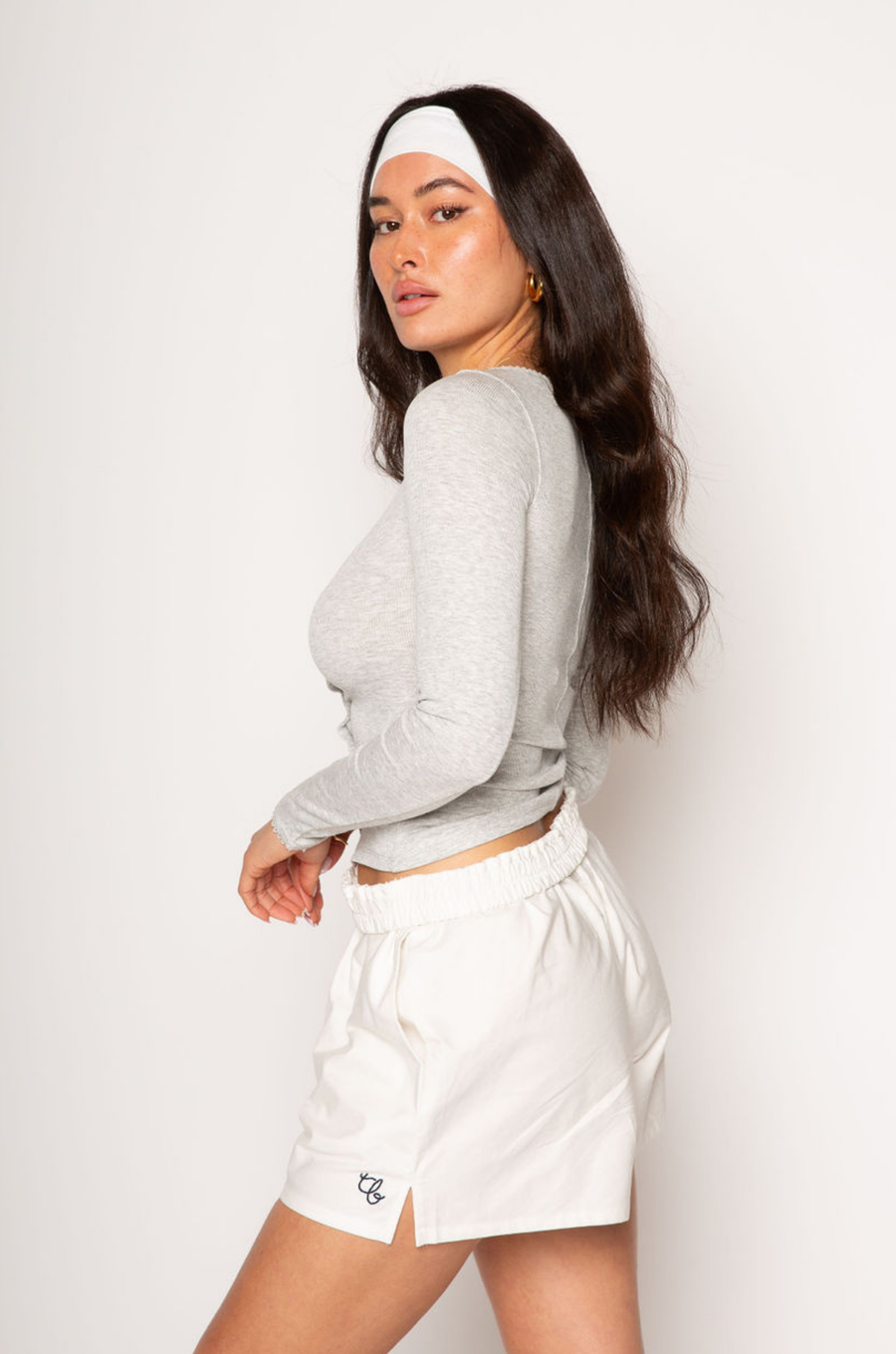 Ribbed knit top. Long sleeves. With elastic sleeve openings. Front button down closures. Unlined. Crochet lace trim. grey long sleeve