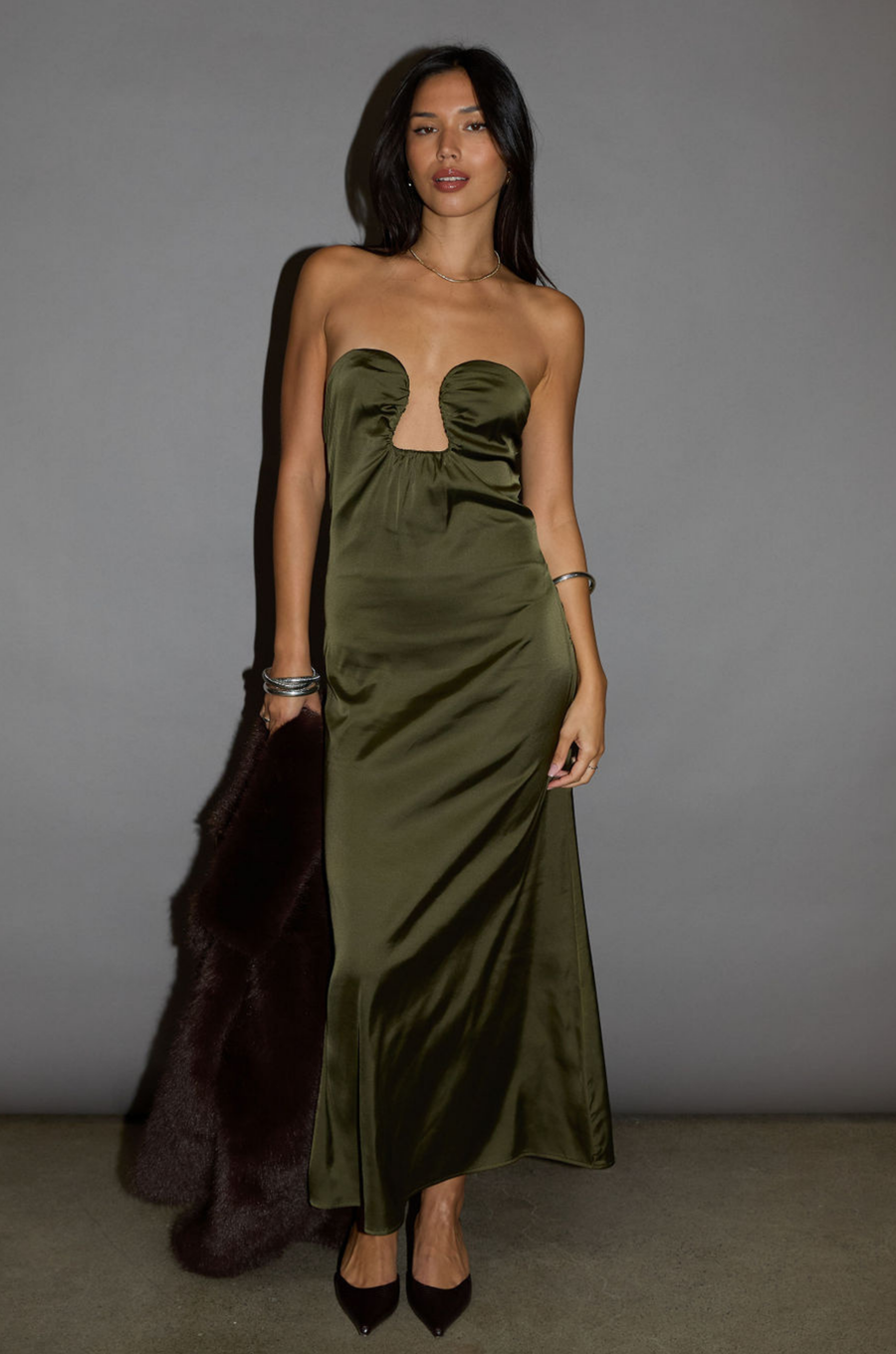 Satin maxi dress. Strapless elastic neckline with inner rubber grip lining. Front wire detail. Side hook and eye and zipper closures. Unlined. olive maxi dress. holiday look. holiday outfit. holiday dress. christmas outfit. christmas dress. new years dress. 