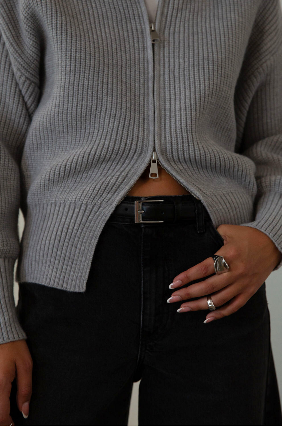 black Adjustable leather belt. Rectangular metal belt buckle.