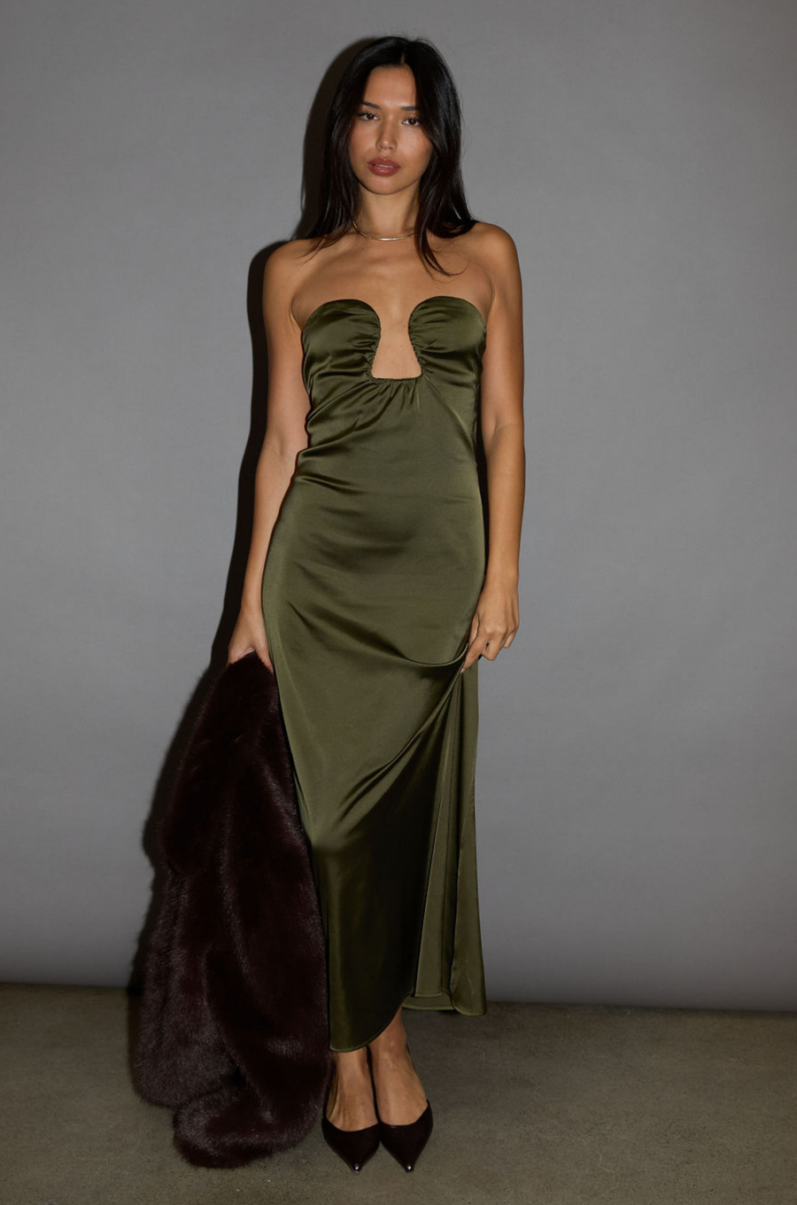 Satin maxi dress. Strapless elastic neckline with inner rubber grip lining. Front wire detail. Side hook and eye and zipper closures. Unlined. olive maxi dress. holiday look. holiday outfit. holiday dress. christmas outfit. christmas dress. new years dress. 