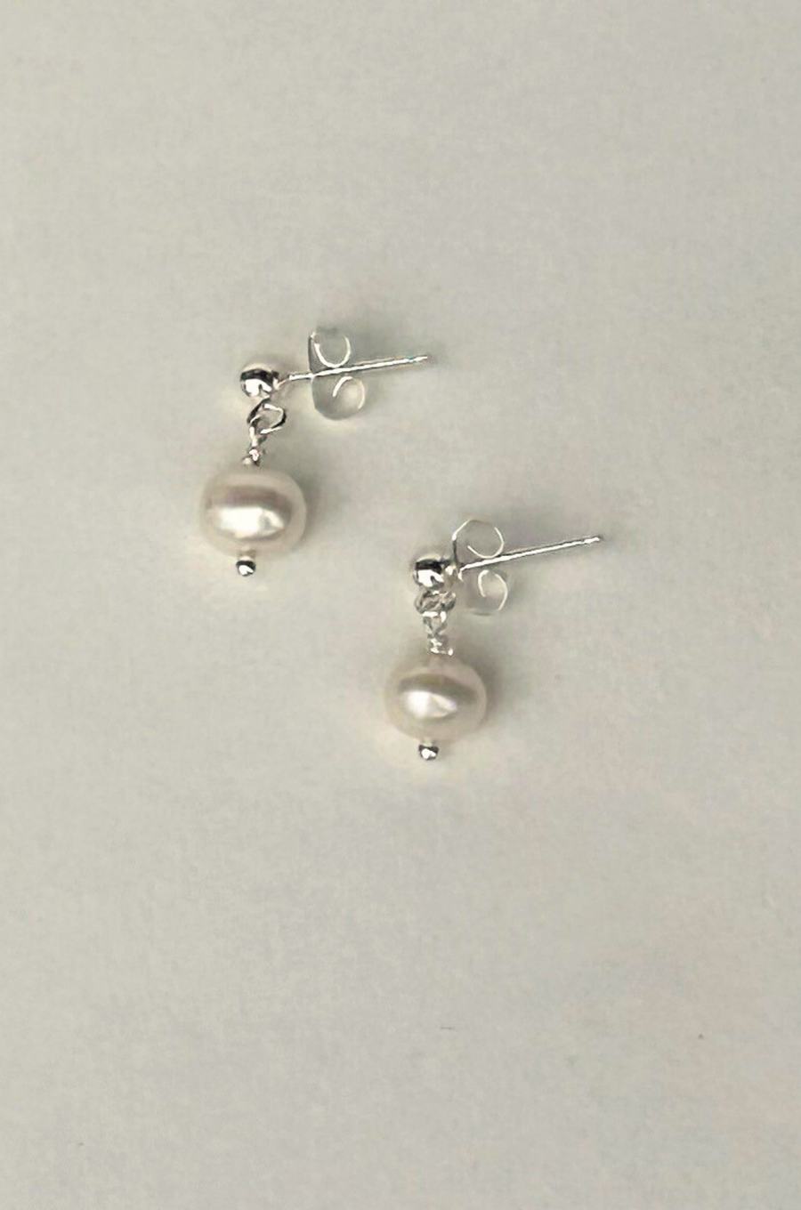 Sterling Silver earring post with freshwater pearls
Size and shape of pearls may vary