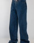 blue Wide leg denim pant
Hidden waistband with adjustable drawstring
5 pocket construction
Button closure
Unlined
Cotton/Polyester
