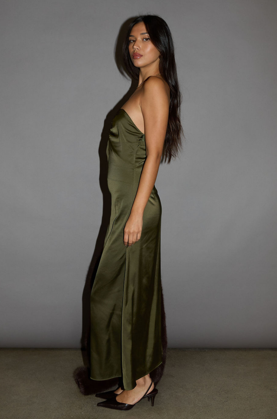 Satin maxi dress. Strapless elastic neckline with inner rubber grip lining. Front wire detail. Side hook and eye and zipper closures. Unlined. olive maxi dress. holiday look. holiday outfit. holiday dress. christmas outfit. christmas dress. new years dress. 