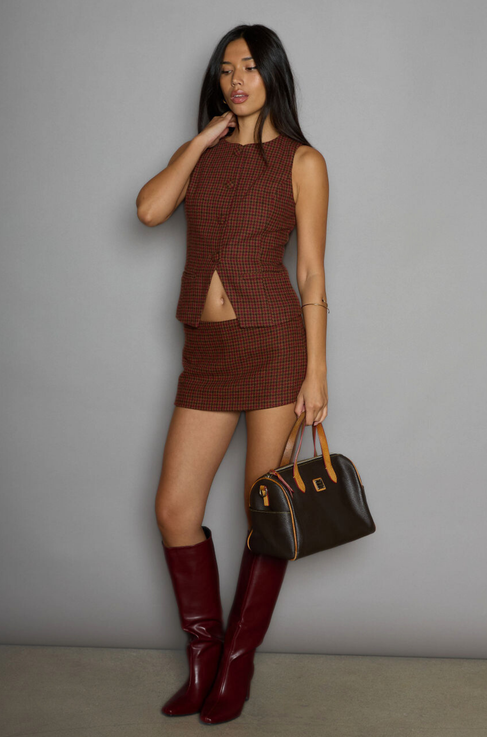 Houndstooth woven sleeveless top. Front button down closure. Front pockets. Fully lined. plaid vest top. plaid skirt set. fall outfit. winter outfit. 