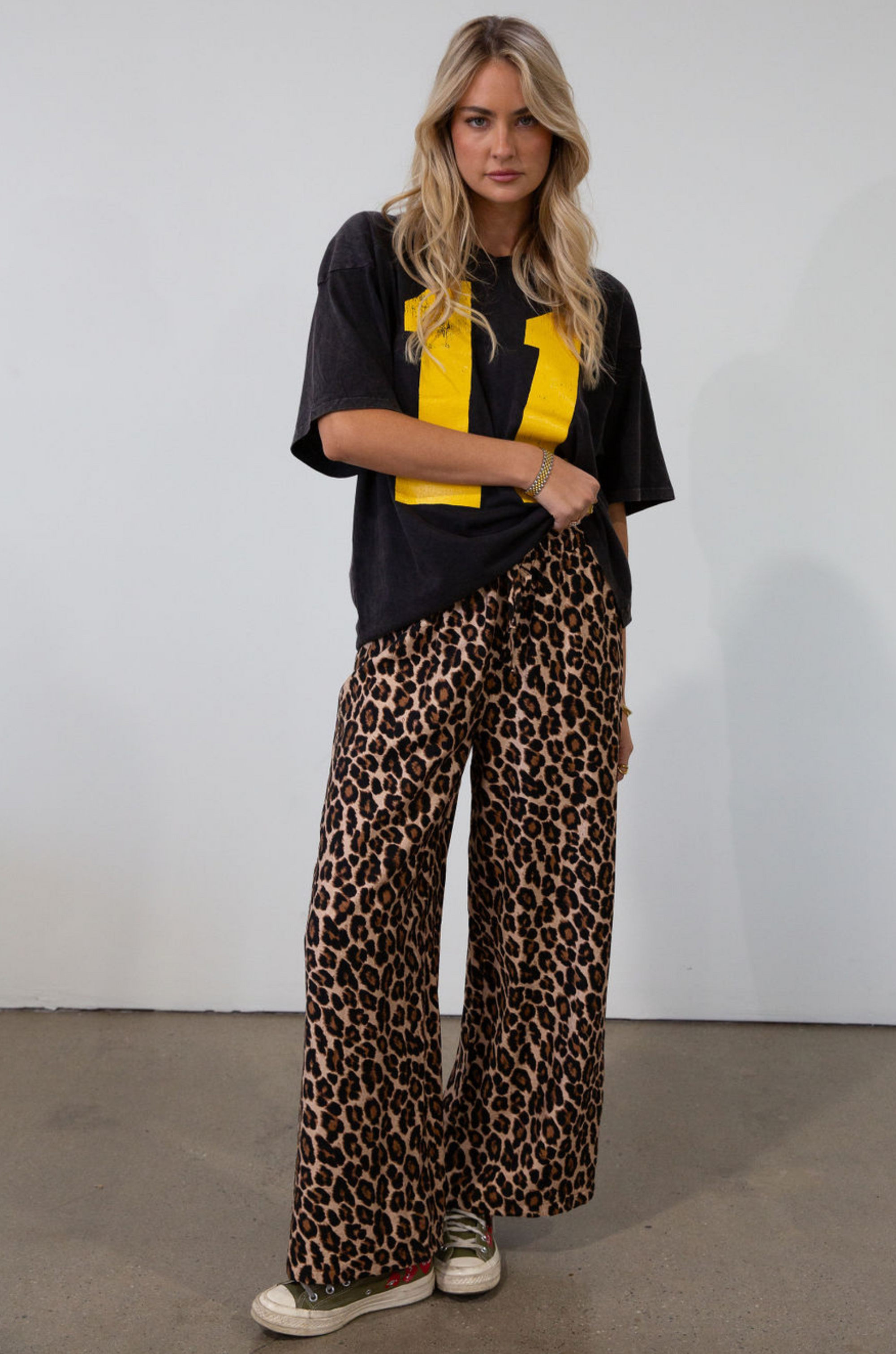 Animal printed woven pants. Elastic waistband with drawstring closure. Unlined.