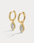 A charmed hoop featuring our most loved marquise cut that catches light with every move
Available in 14kt gold plated brass or Rhodium plated brass
Stones are white cz and measure 10mm x 5.0mm each
Snap Hinge Closure
Sold as a pair
gold cz earrings
fake diamond earrings