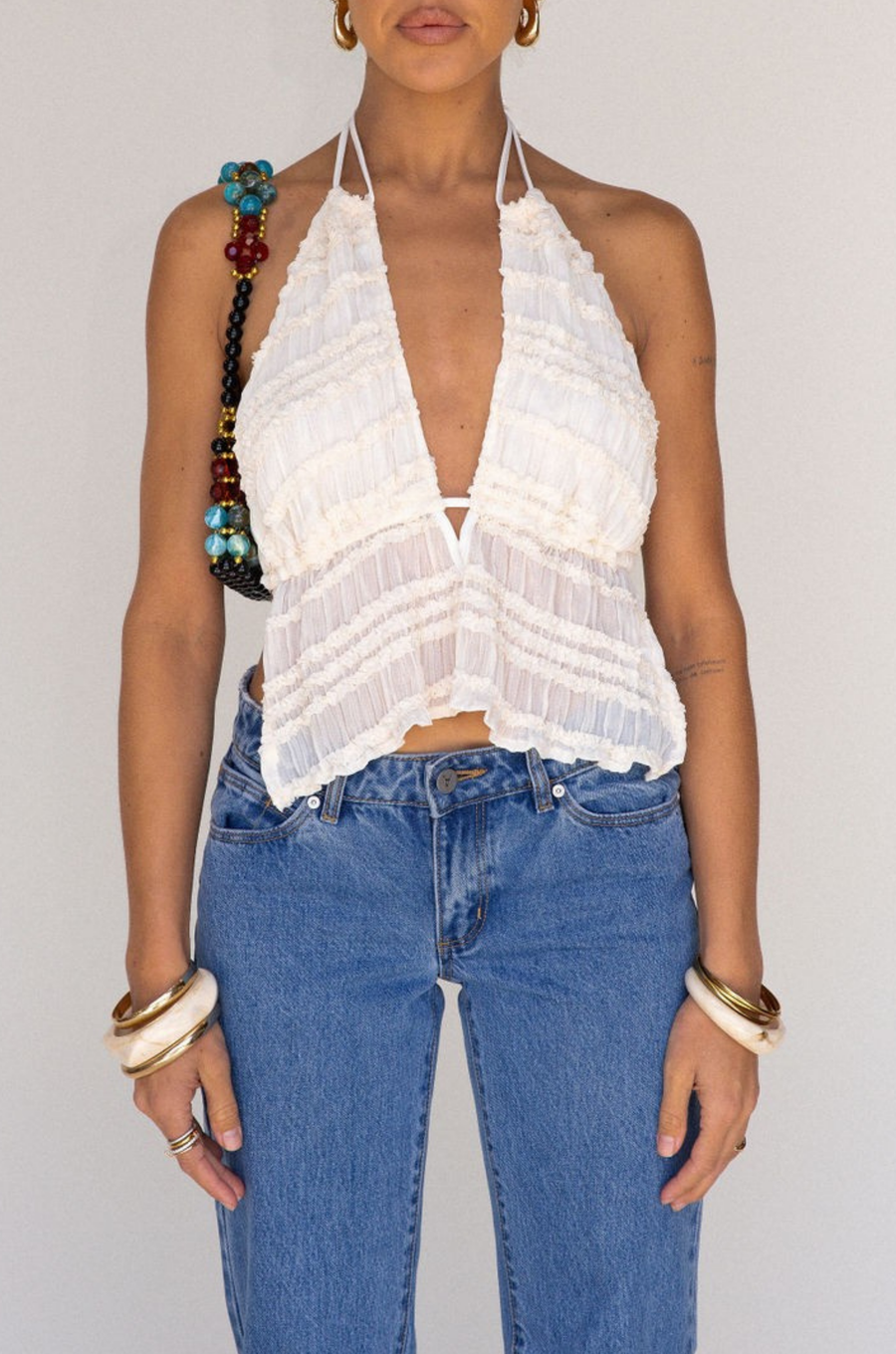 cream white Chiffon woven smocked halter top
Adjustable neck and back tie
Ruffle detail
Backless
Partially lined/sheer
bachelorette top outfit
going out top outfit
white tank top