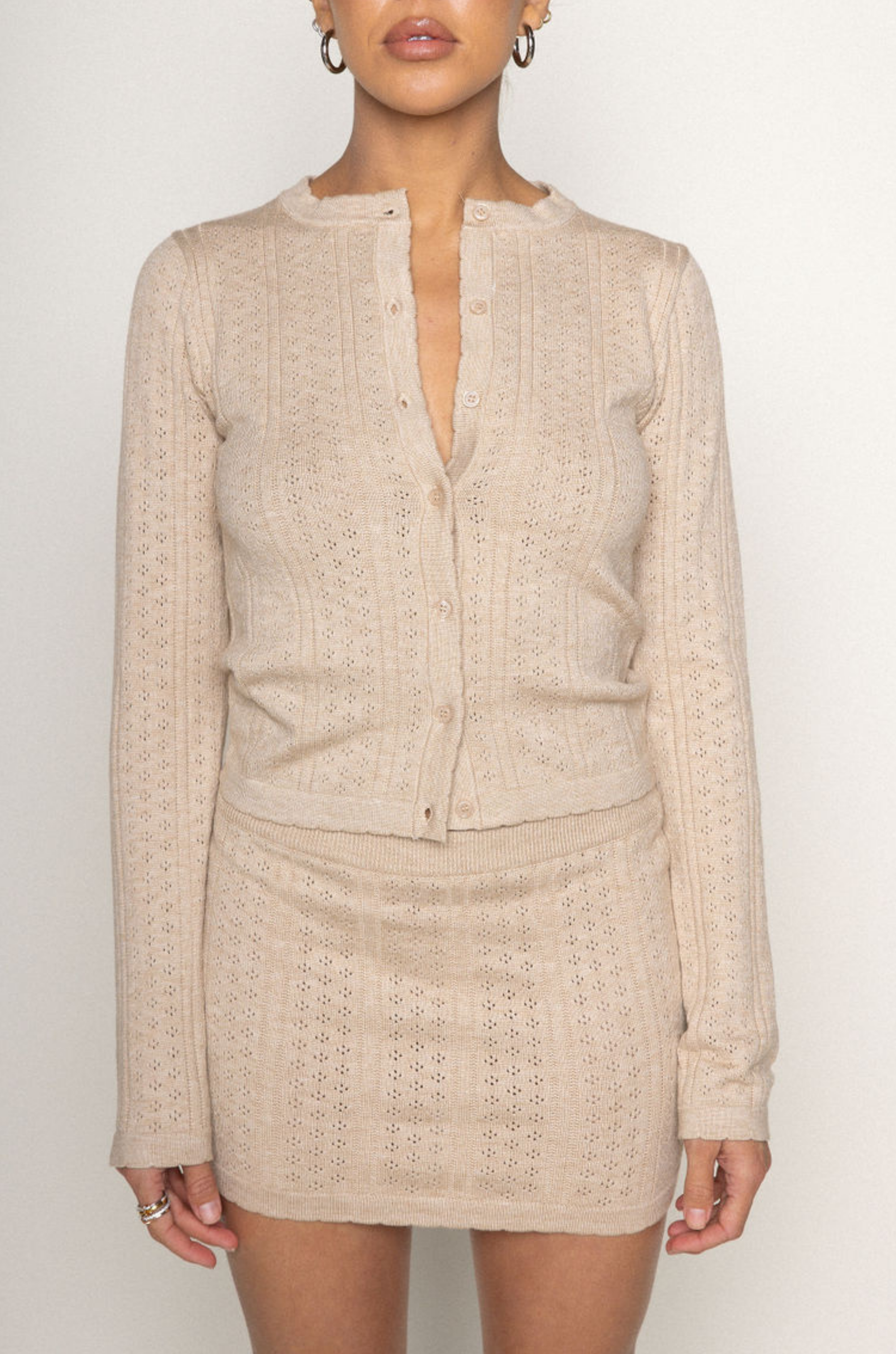 TOP
tan Knit eyelet cardigan
Scollop trim
Front button closure
Unlined

SKIRT
tan Knit eyelet mini skirt
Scallop trim
Elastic waistband
Unlined

summer knit set
spring knit set